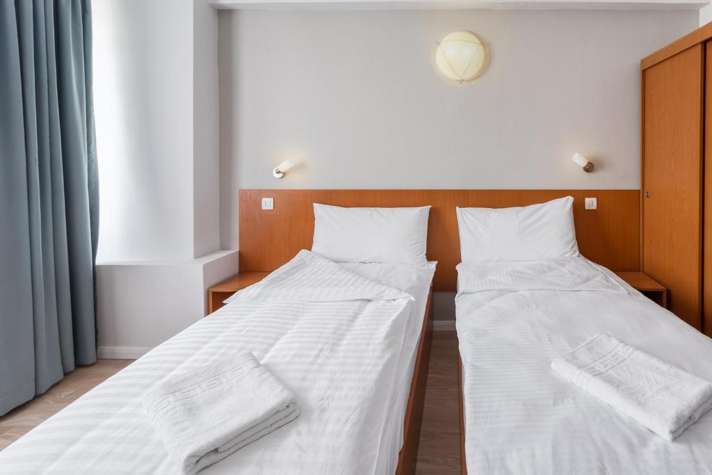 Postel nebo postele na pokoji v ubytování Elizeu Hotel