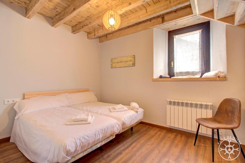 Posteľ alebo postele v izbe v ubytovaní CASA ERA CUMA de Alma de Nieve