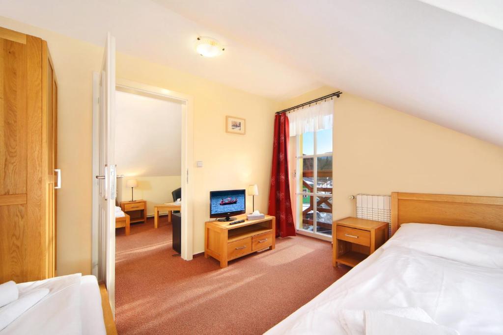 Postel nebo postele na pokoji v ubytování Hotel Erika