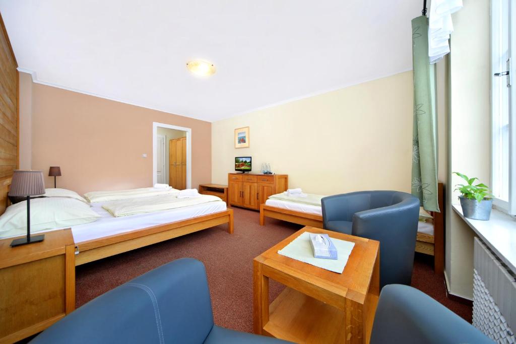 Postel nebo postele na pokoji v ubytování Hotel Erika