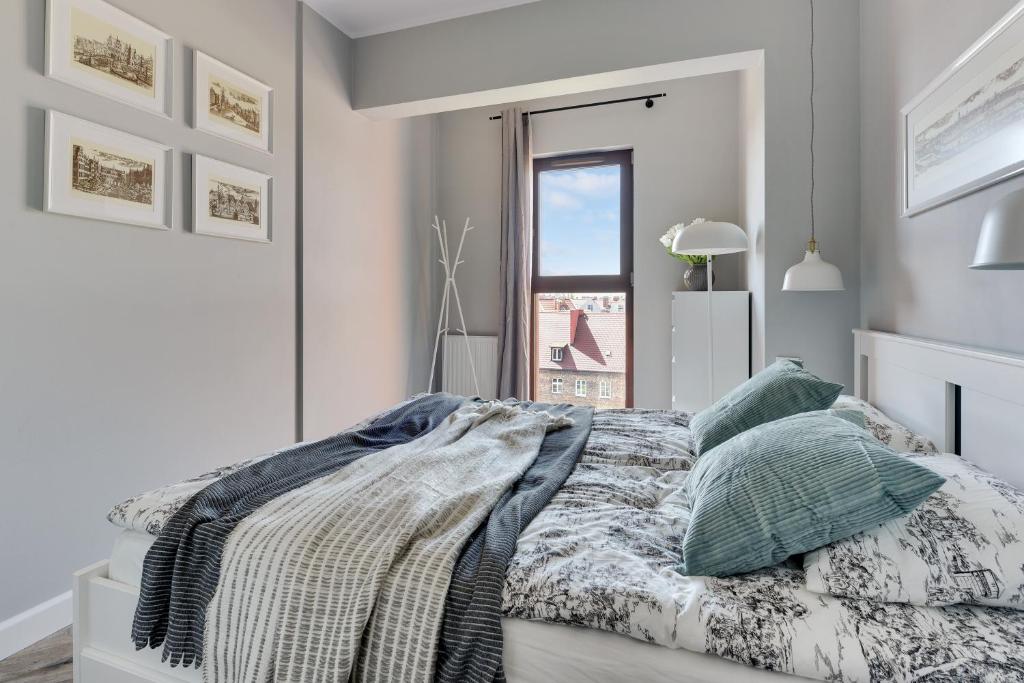 Posteľ alebo postele v izbe v ubytovaní Staywin Apartments Chmielna Park