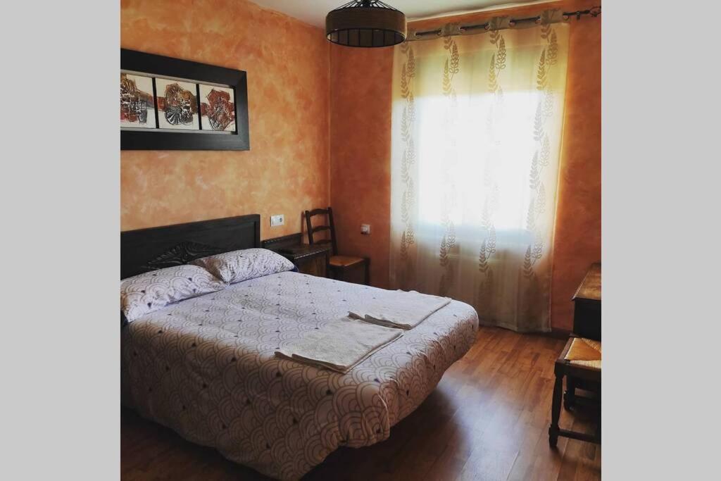 Posteľ alebo postele v izbe v ubytovaní Casa Rural La Vizana