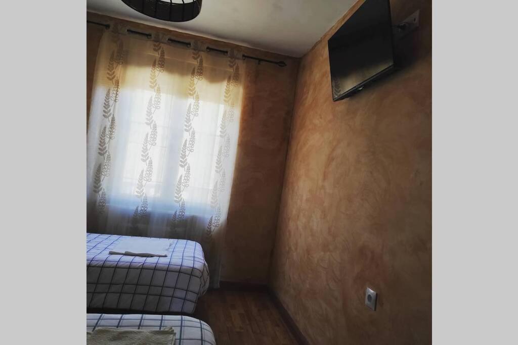 Posteľ alebo postele v izbe v ubytovaní Casa Rural La Vizana