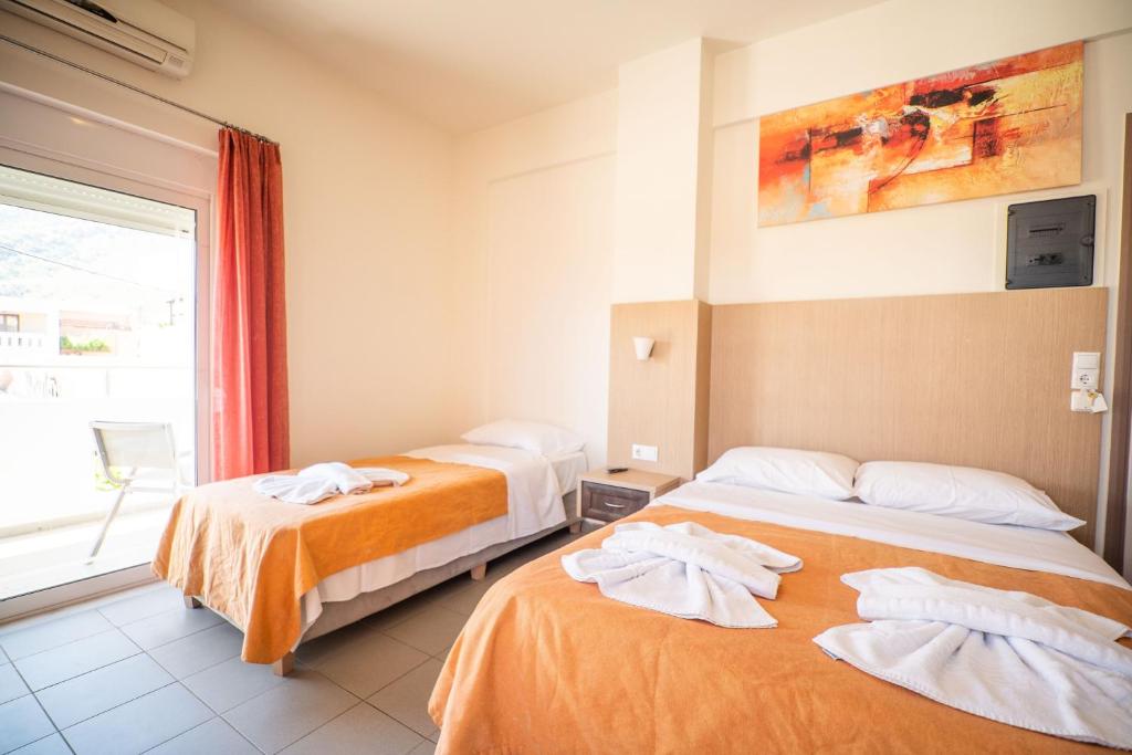 Posteľ alebo postele v izbe v ubytovaní Kokalas Resort