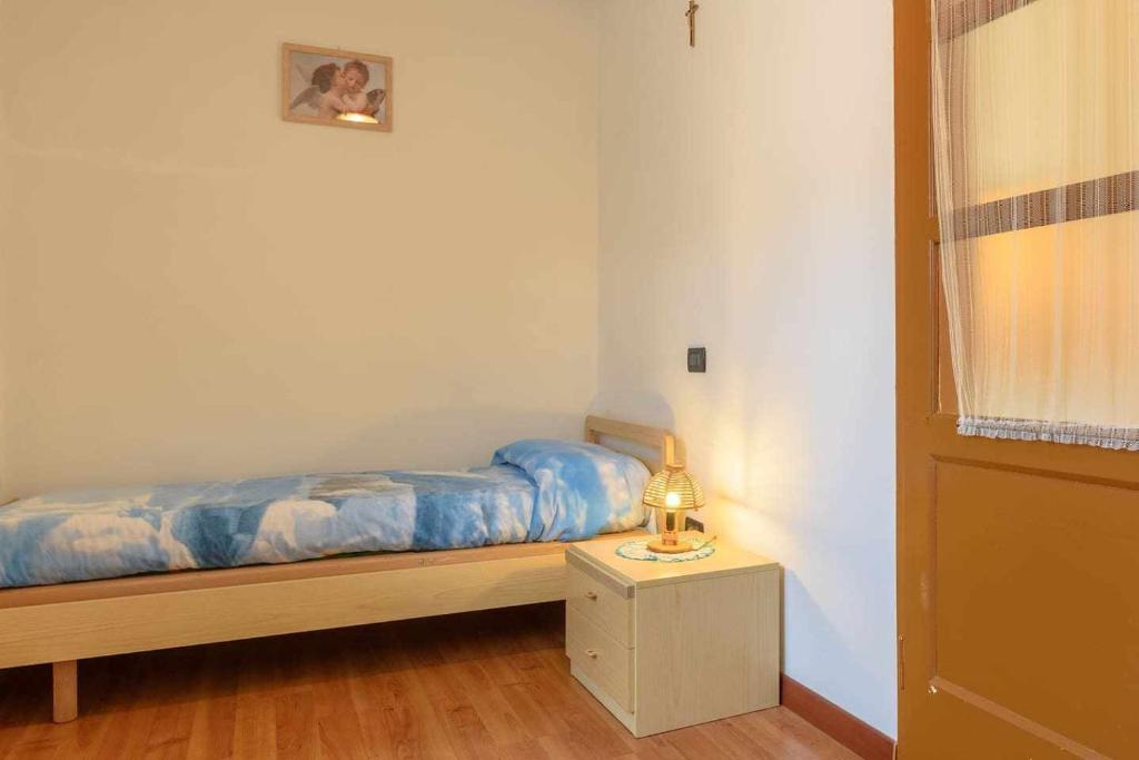 Posteľ alebo postele v izbe v ubytovaní Appartamento Da Vittoria Valda Val di Cembra