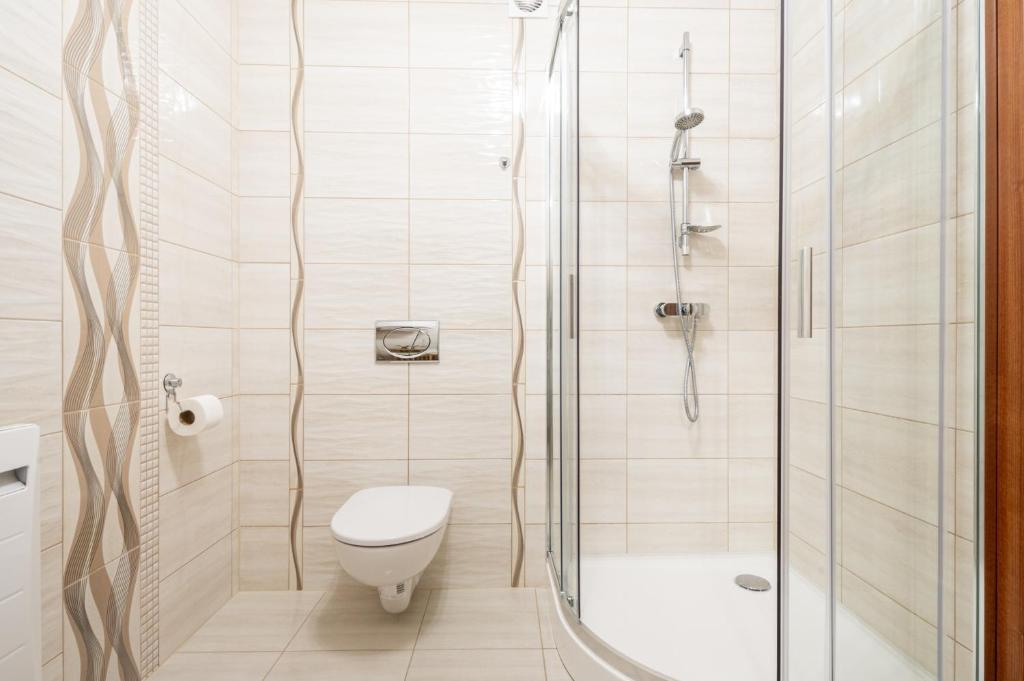 Kúpeľňa v ubytovaní Apartamenty na wzgórzu APARTZAKOP