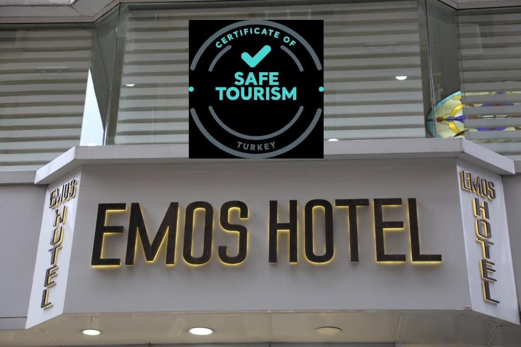 a sign for an ems hotel on top of a building at EMOS HOTEL in Istanbul