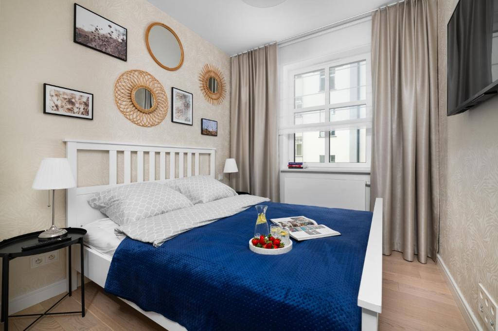 Posteľ alebo postele v izbe v ubytovaní W Sercu Warszawy Apartamenty