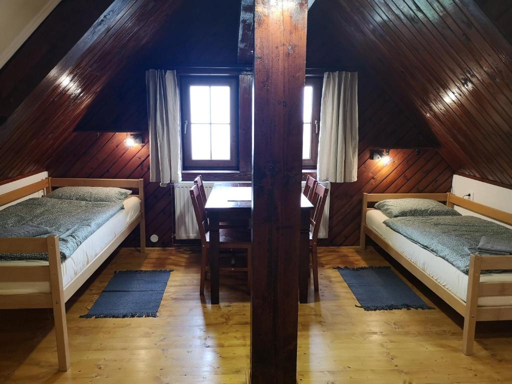 Postel nebo postele na pokoji v ubytování Motorest SKI Čertovica