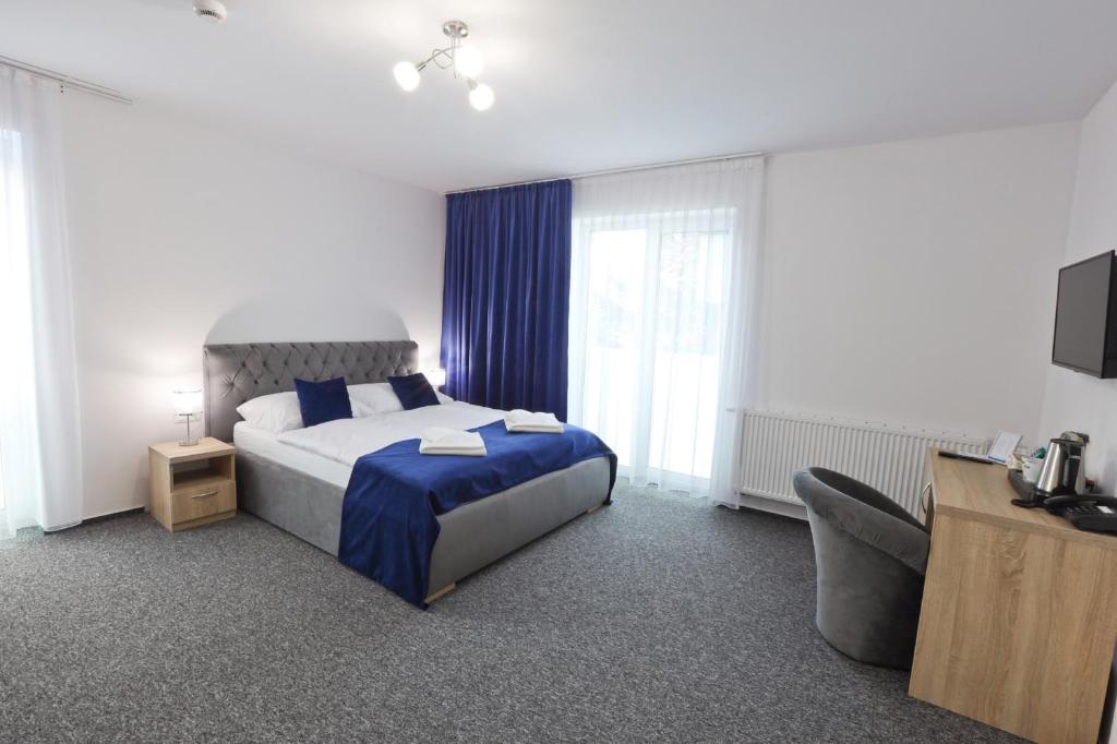 Postel nebo postele na pokoji v ubytování Hotel Prístav