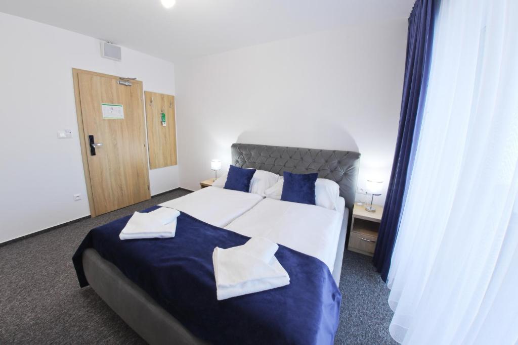 Postel nebo postele na pokoji v ubytování Hotel Prístav