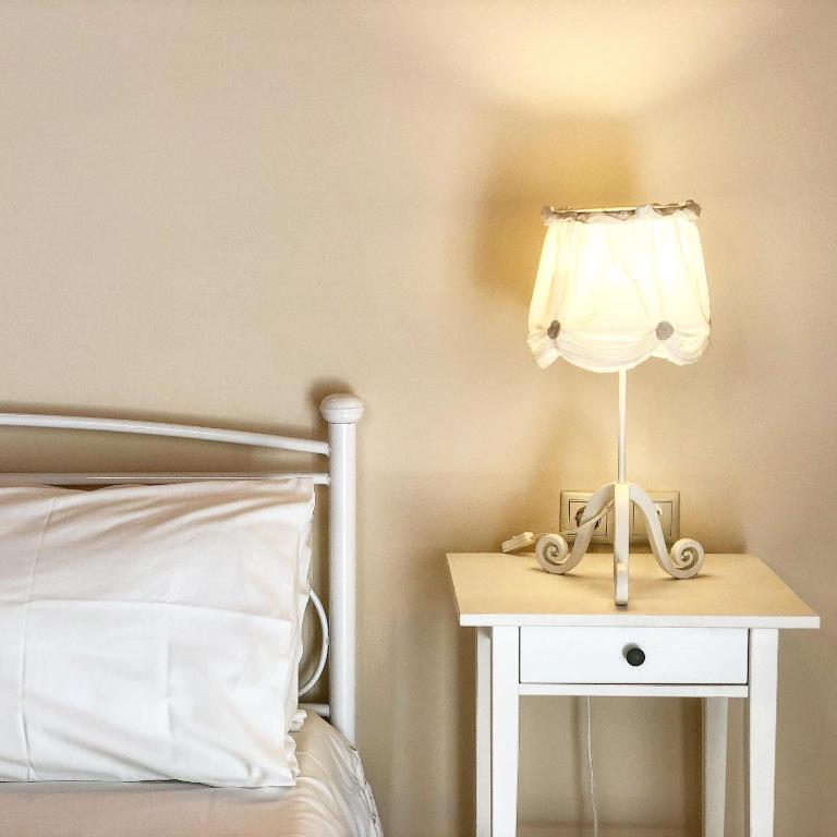 Postel nebo postele na pokoji v ubytování Helianthus Apartments