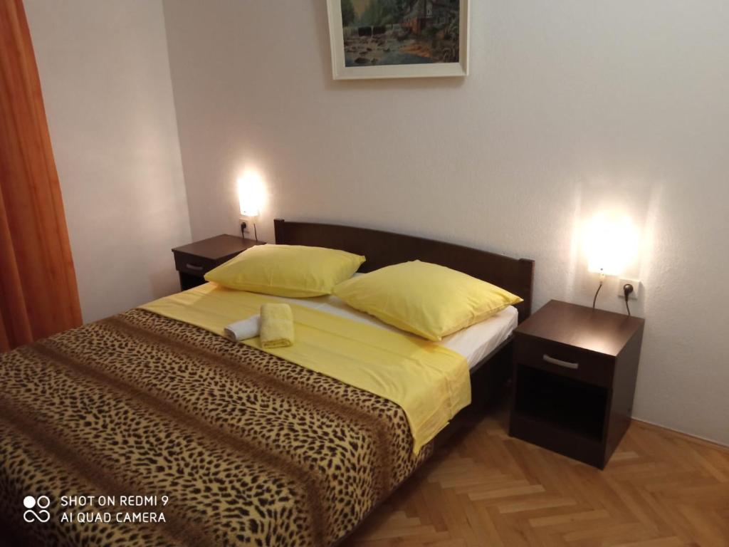 Postel nebo postele na pokoji v ubytování Apartmani Čović