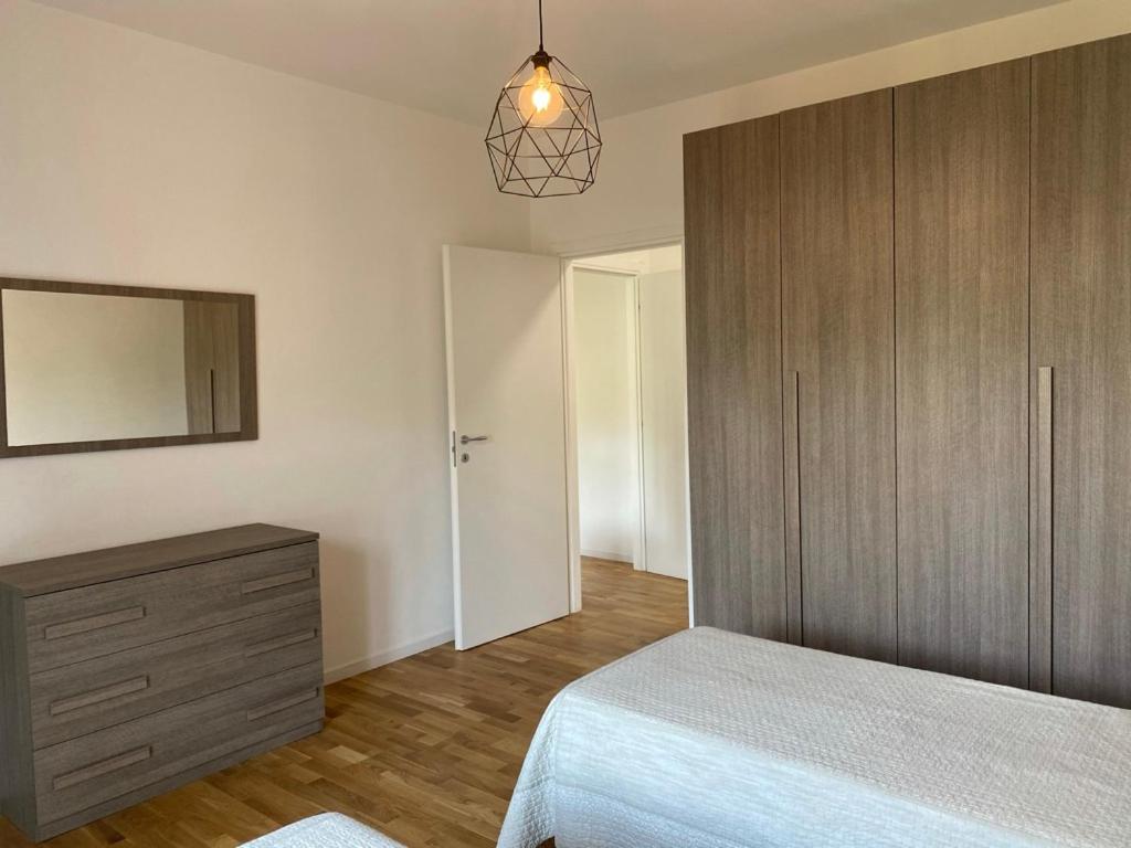 A bed or beds in a room at Appartamento Massa