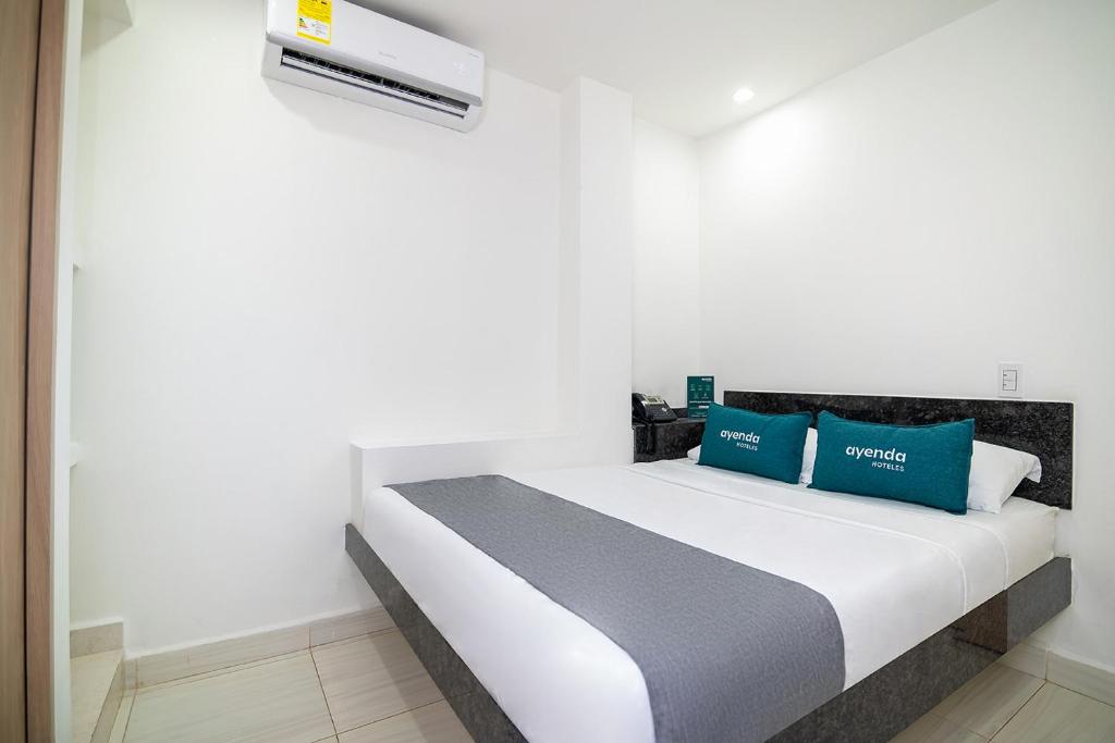 Hotel Esperanza AC tesisinde bir odada yatak veya yataklar