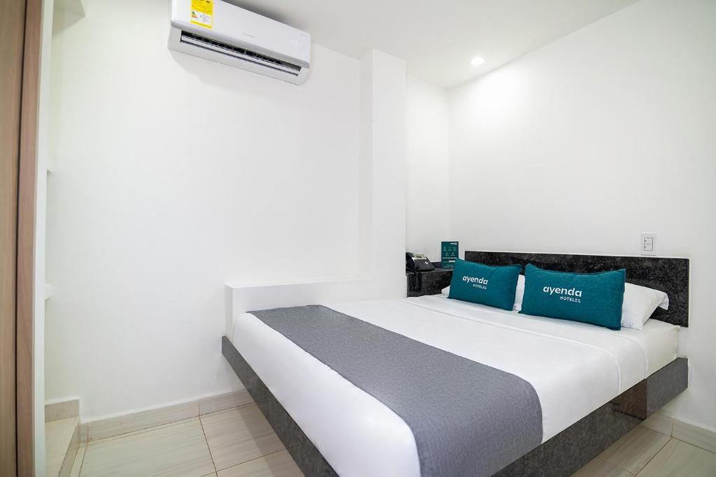 Postel nebo postele na pokoji v ubytování Hotel Esperanza AC