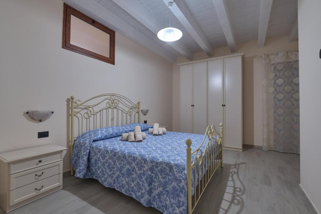 Łóżko lub łóżka w pokoju w obiekcie La rosa dei venti, apartment 3