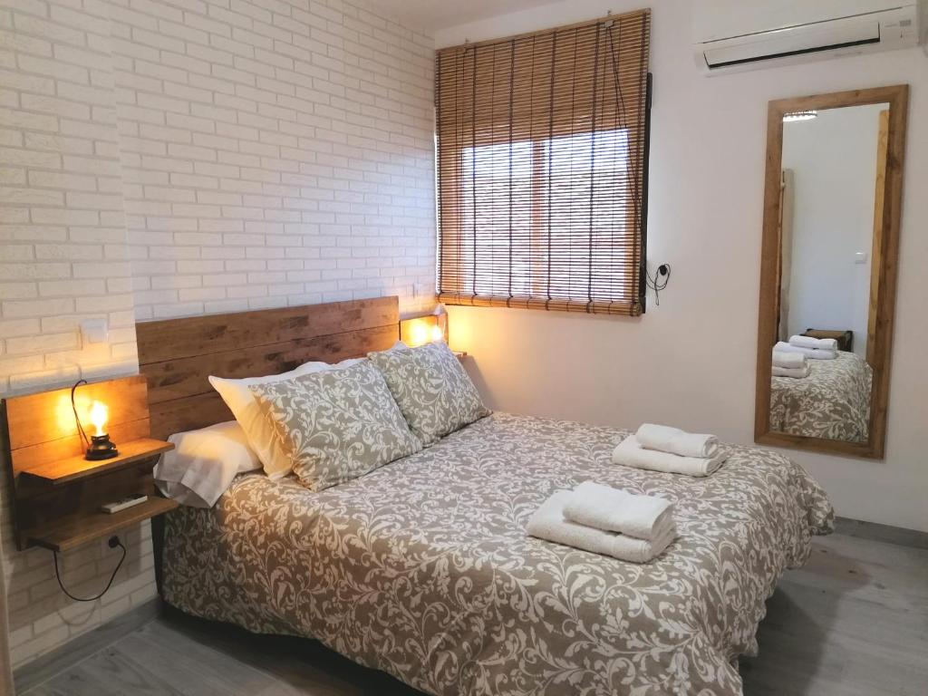 Postel nebo postele na pokoji v ubytování LA CASA DE LA ABUELA DESI