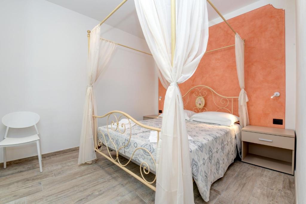 Postel nebo postele na pokoji v ubytování Borgo Ermanno
