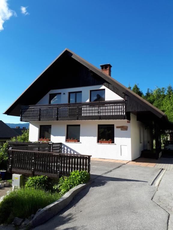 a large white house with a black roof at 238 Spodnje Gorje in Spodnje Gorje