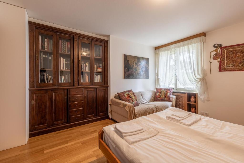 A bed or beds in a room at Casa Alverà
