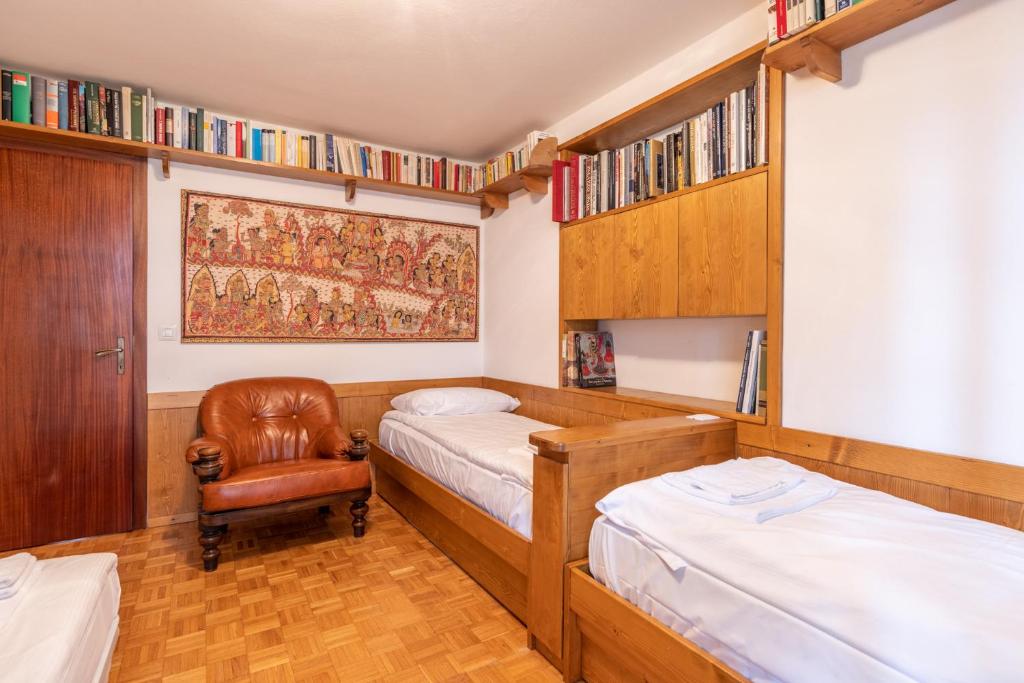 A bed or beds in a room at Casa Alverà