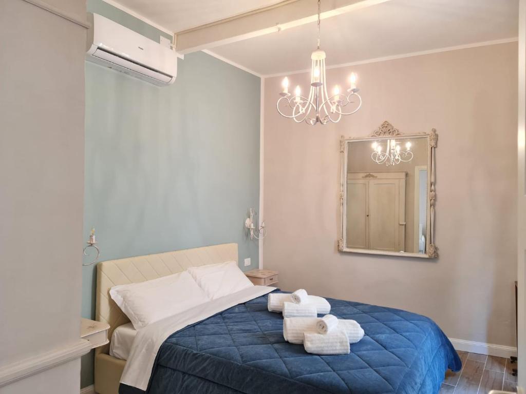 מיטה או מיטות בחדר ב-Maison Marina_Pavia San Michele Centro Storico
