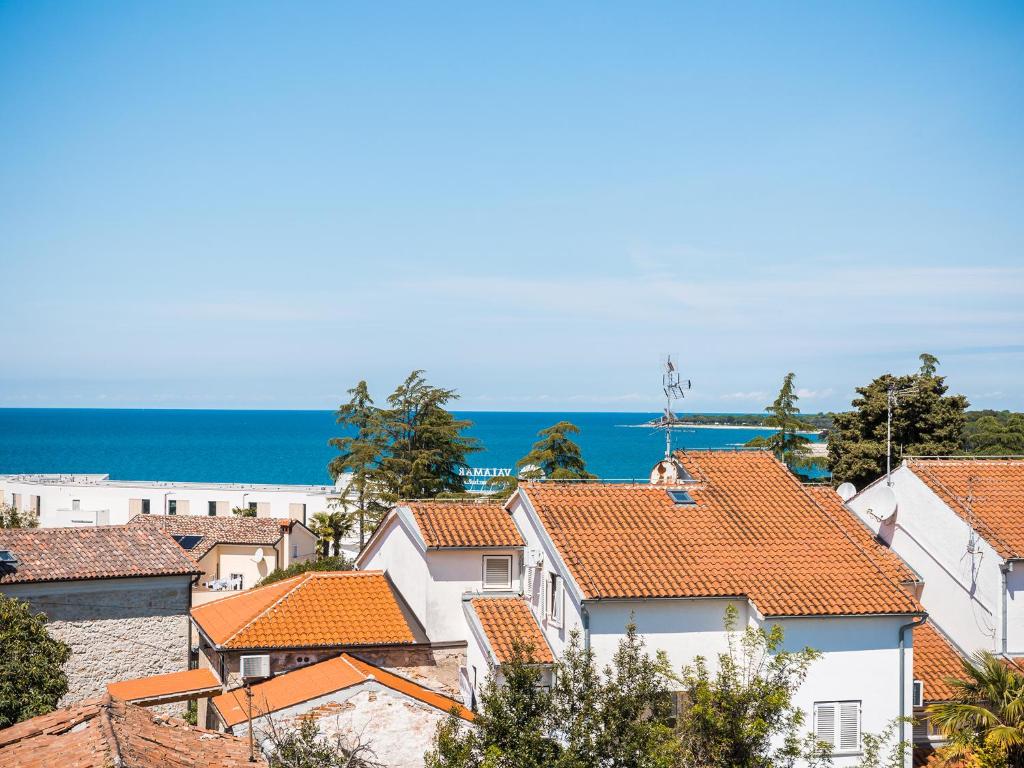 a view of a town with orange roofs at Apartments Špadići in Poreč