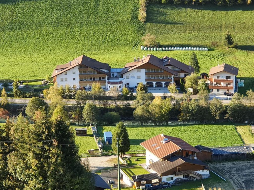 an aerial view of a house in a field at Hotel Sonja in Cadipietra