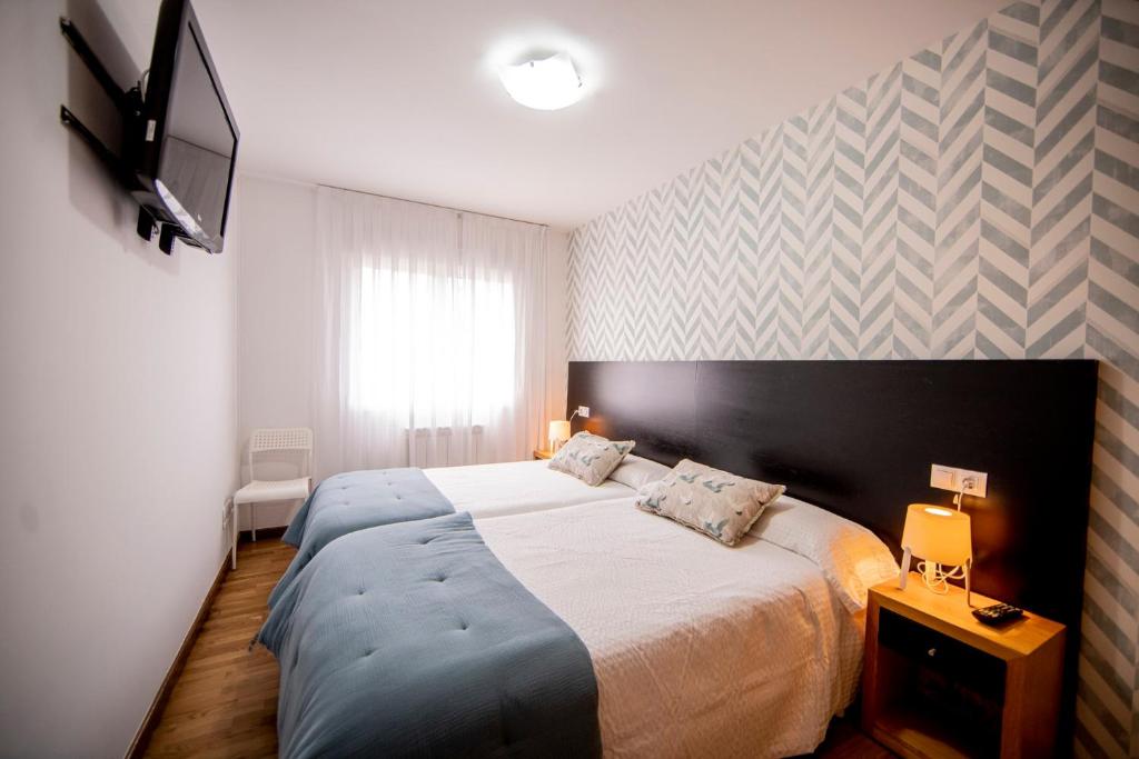 Posteľ alebo postele v izbe v ubytovaní Noja Rooms