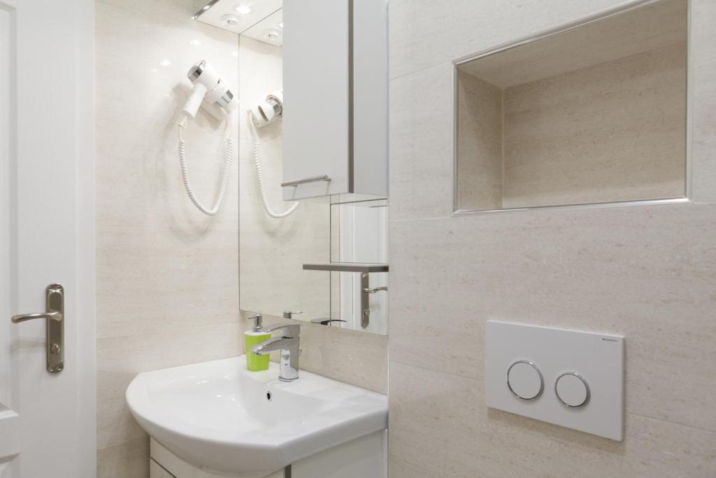 Koupelna v ubytování Riva Rooms