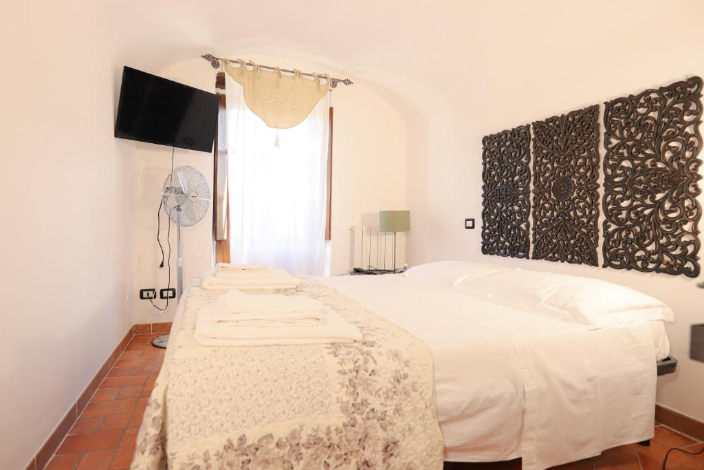 Posteľ alebo postele v izbe v ubytovaní B&B Luna & Stelle