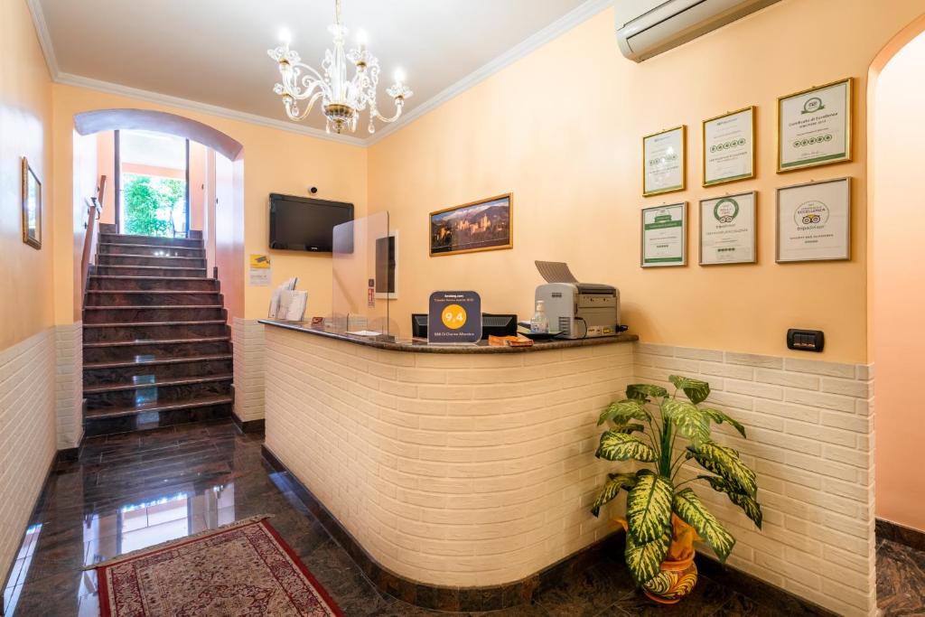 Televízia a/alebo spoločenská miestnosť v ubytovaní ALHAMBRA - Guest House di Charme