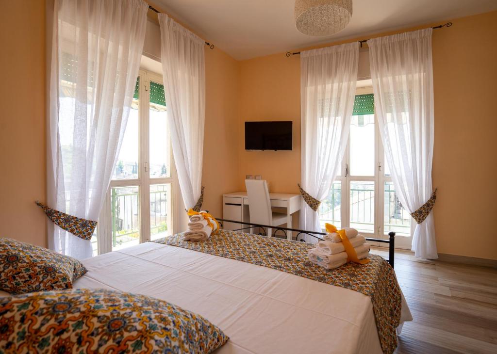 a bedroom with a bed with two stuffed animals on it at B&B Sogno - Camere con vista a Vietri Sul Mare in Vietri