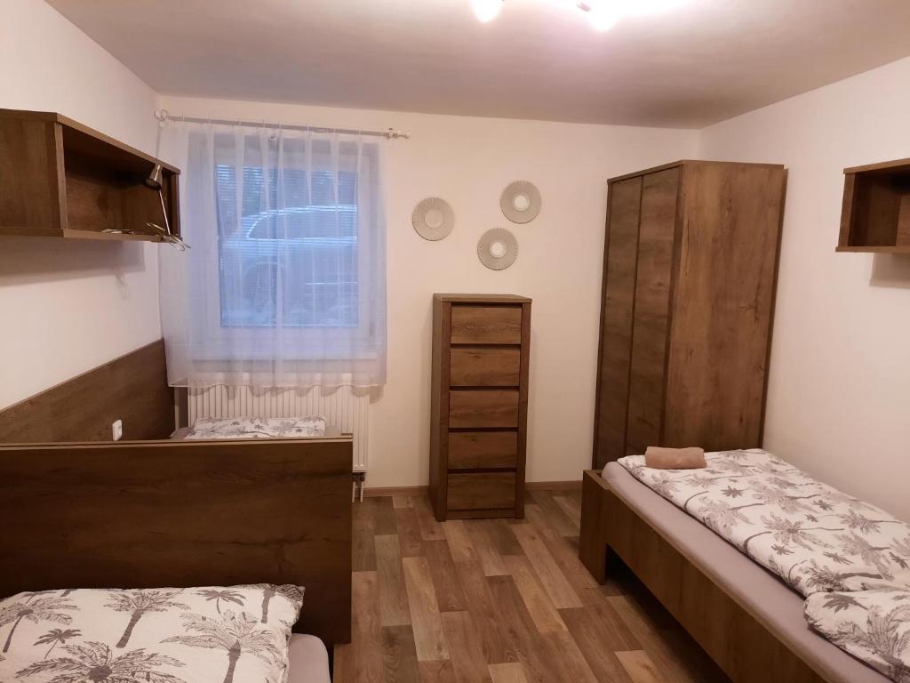 Postel nebo postele na pokoji v ubytování Apartmány Moravia