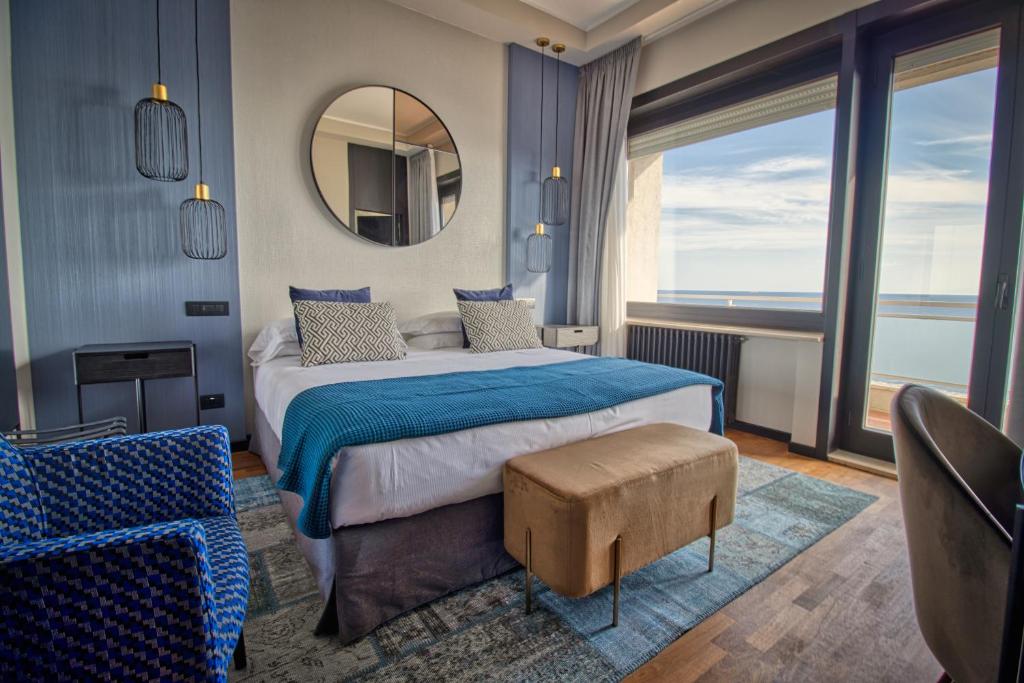 Postel nebo postele na pokoji v ubytování Grand Hotel Passetto