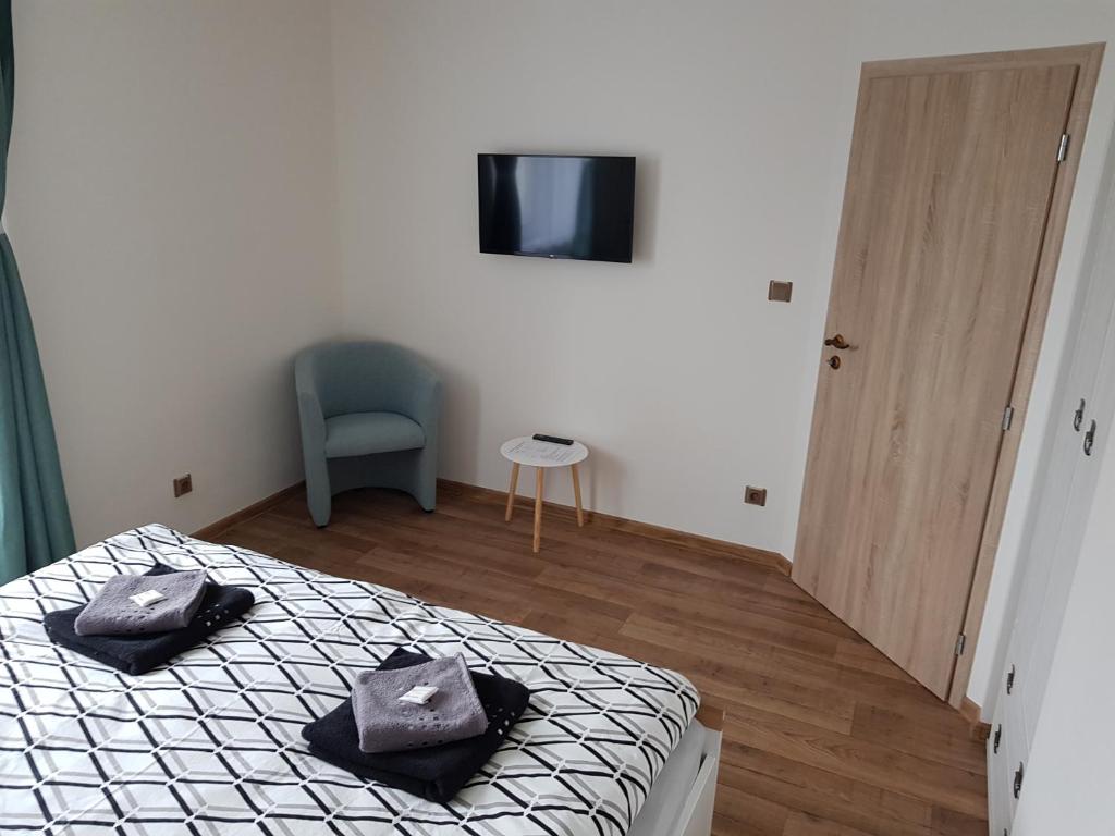 Postel nebo postele na pokoji v ubytování Apartmán Na Pekárně