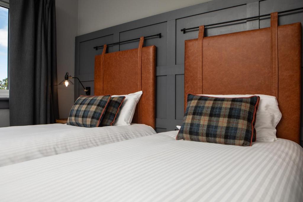 Postel nebo postele na pokoji v ubytování The Hebridean - Rooms & Apartments