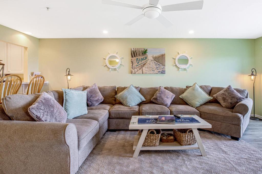 a living room with a couch and a table at Bethany Bay --- 4703 Pettinaro in Ocean View