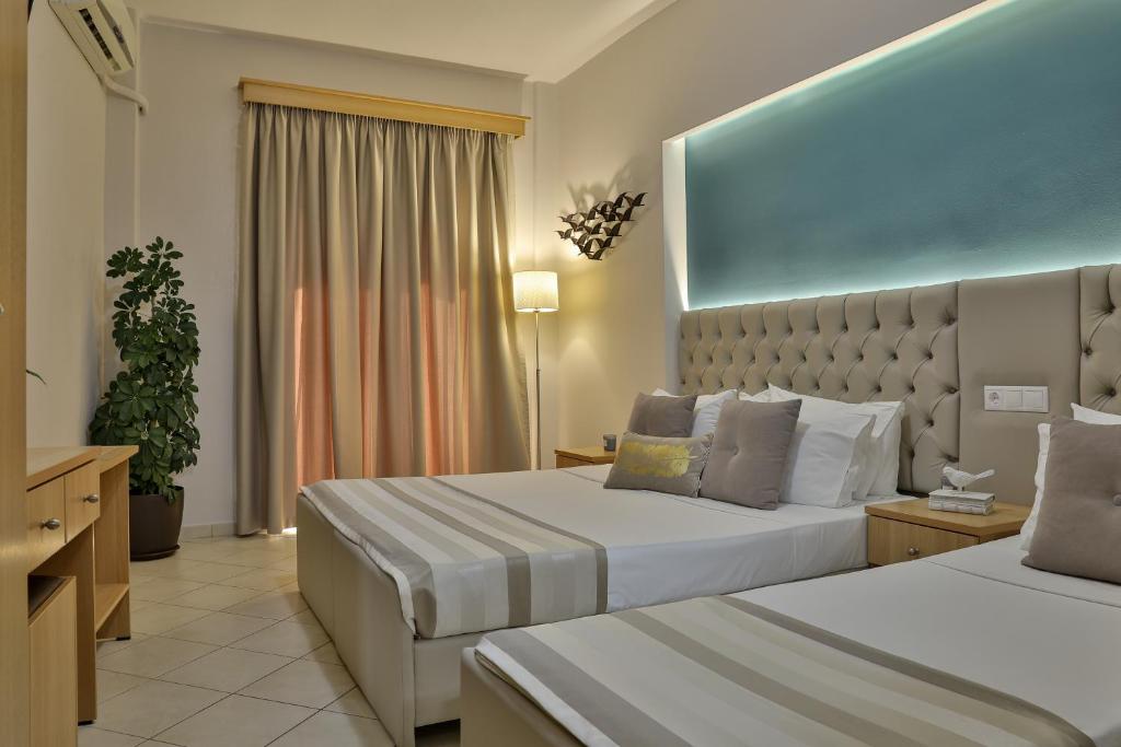 Postel nebo postele na pokoji v ubytování Irida Apartments