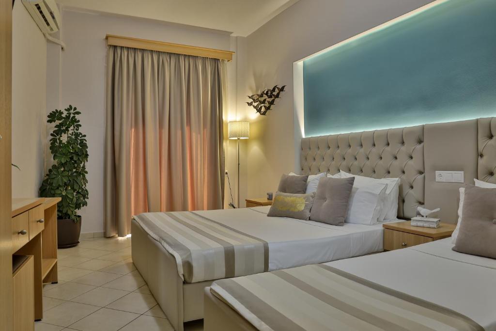 Postel nebo postele na pokoji v ubytování Irida Apartments