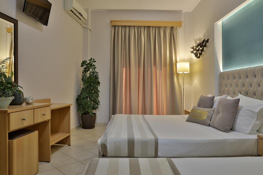 Postel nebo postele na pokoji v ubytování Irida Apartments