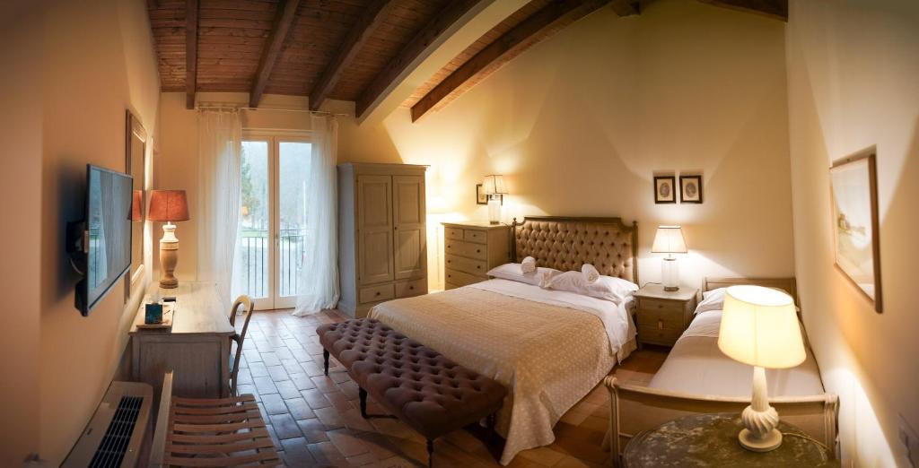 Säng eller sängar i ett rum på Parco di Montebello