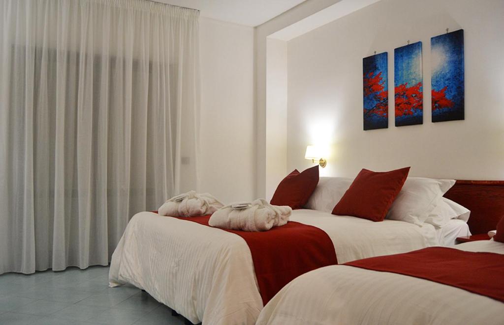 Postel nebo postele na pokoji v ubytování Tafuri Hotel