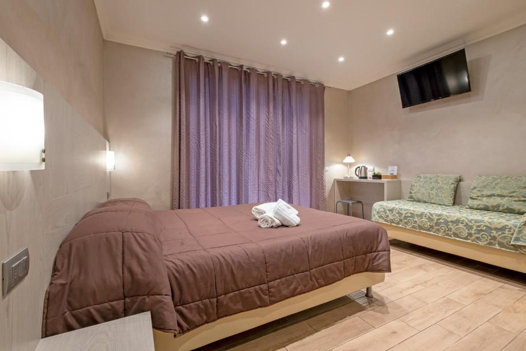 A bed or beds in a room at Nanà