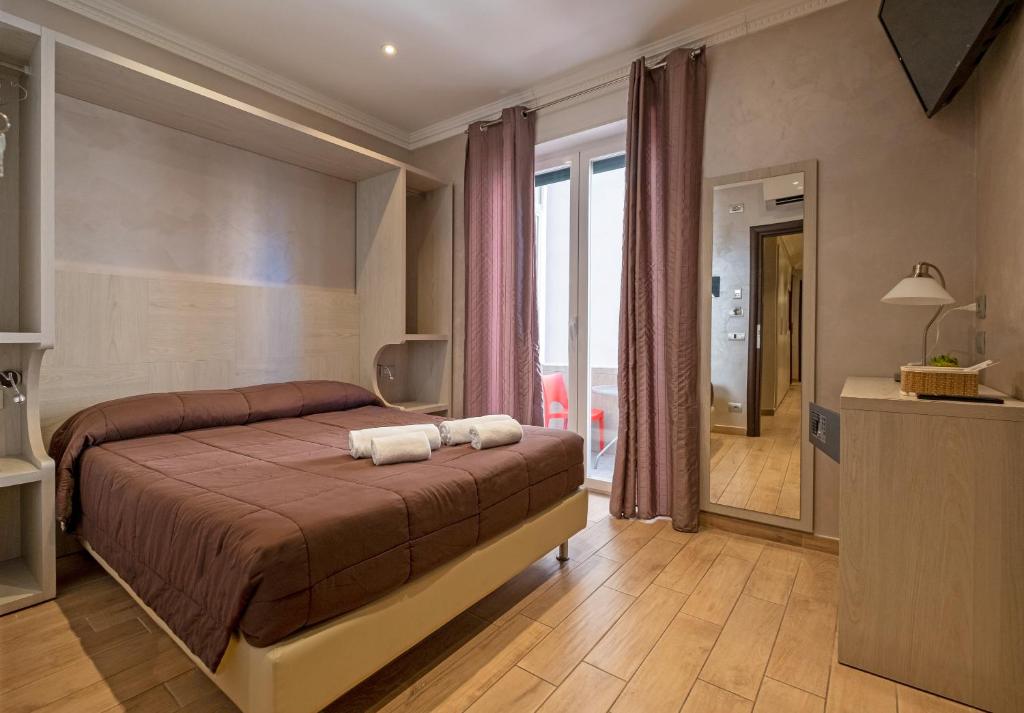 A bed or beds in a room at Nanà