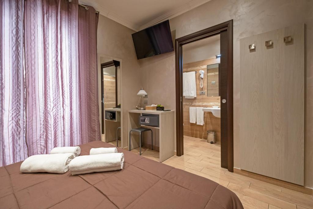 A bed or beds in a room at Nanà