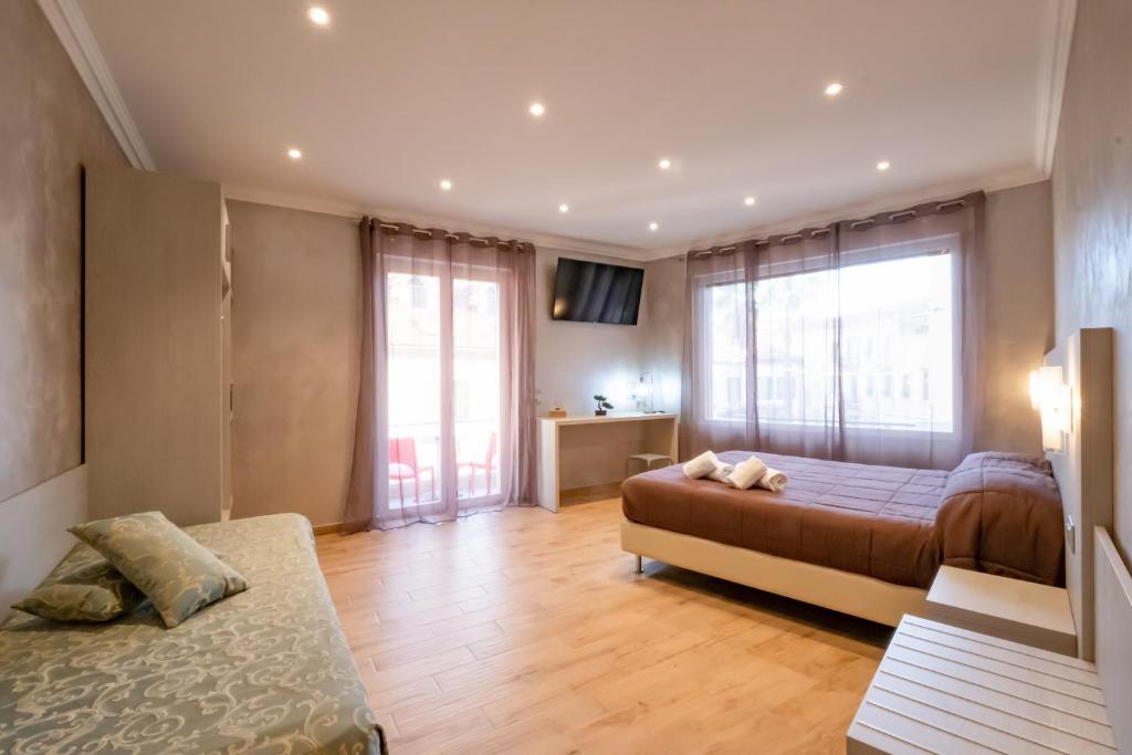 A bed or beds in a room at Nanà