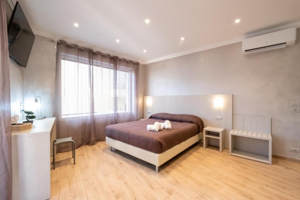 A bed or beds in a room at Nanà