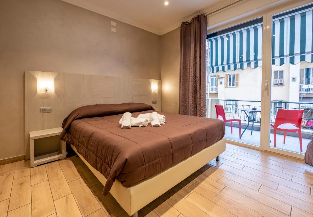 A bed or beds in a room at Nanà